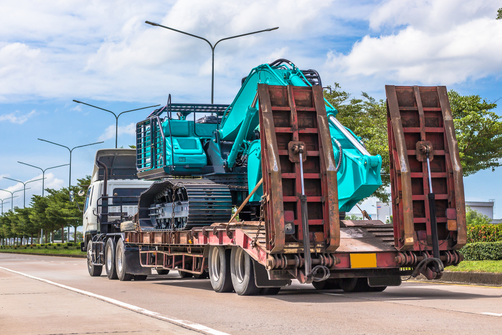 Backhoe,Truck,Trailer,Runs,Through,The,Industrial,Estate.,Ready,To