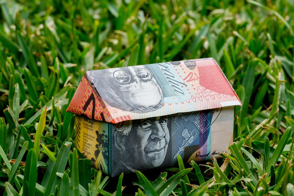 Origami,House,Made,With,Australian,Notes,Sitting,On,Lawn